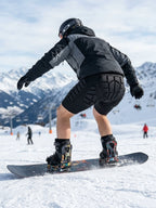 Snowboarder wearing Pactline snow impact shorts on the mountain